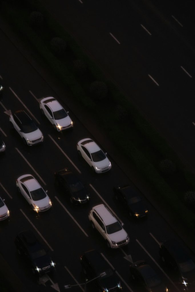 an overhead view of a parking lot at night